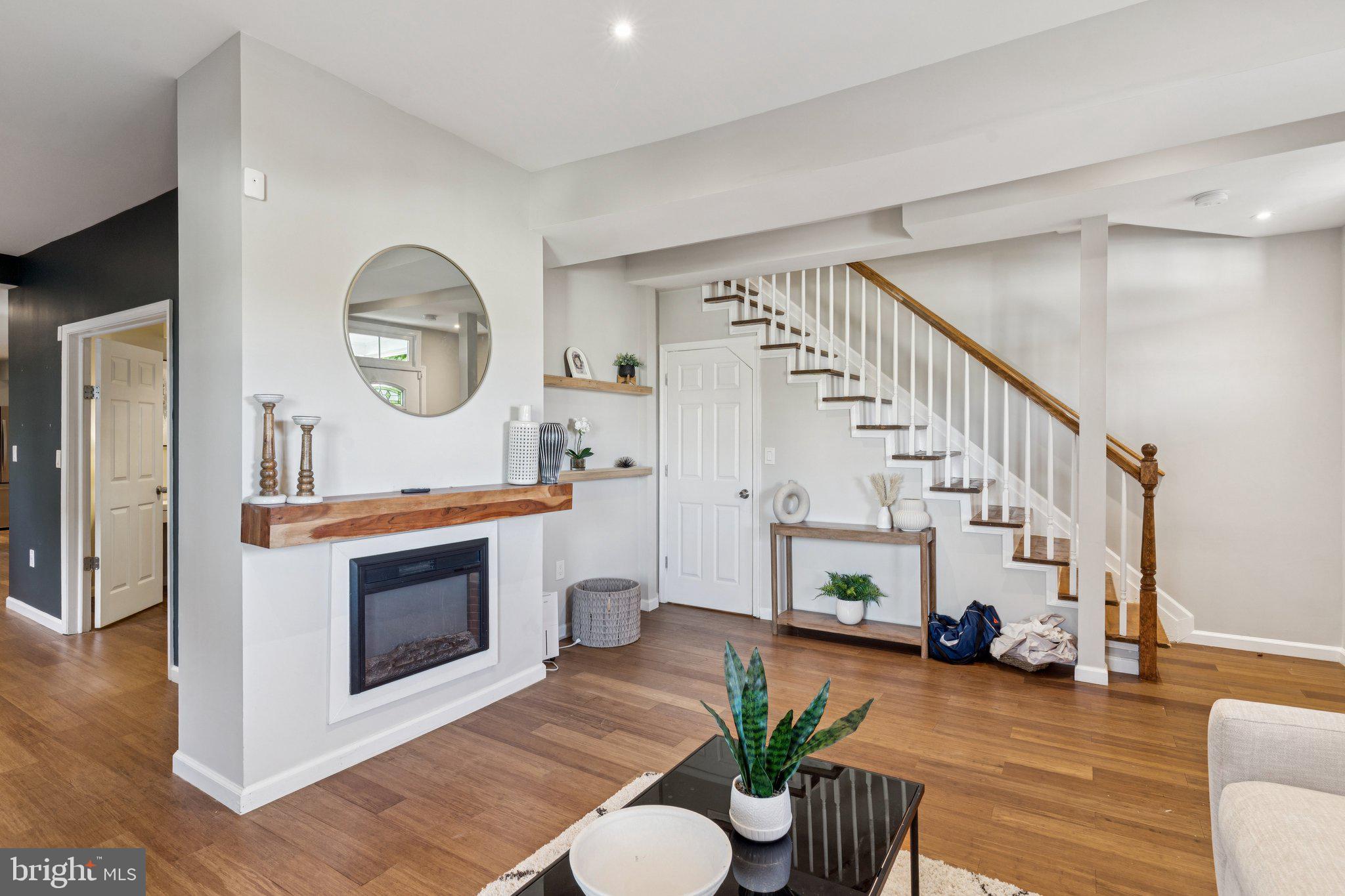4001 Shepherd Street Brentwood, MD 20722 - Photo 6 of 39 a living room with furniture and a fireplace