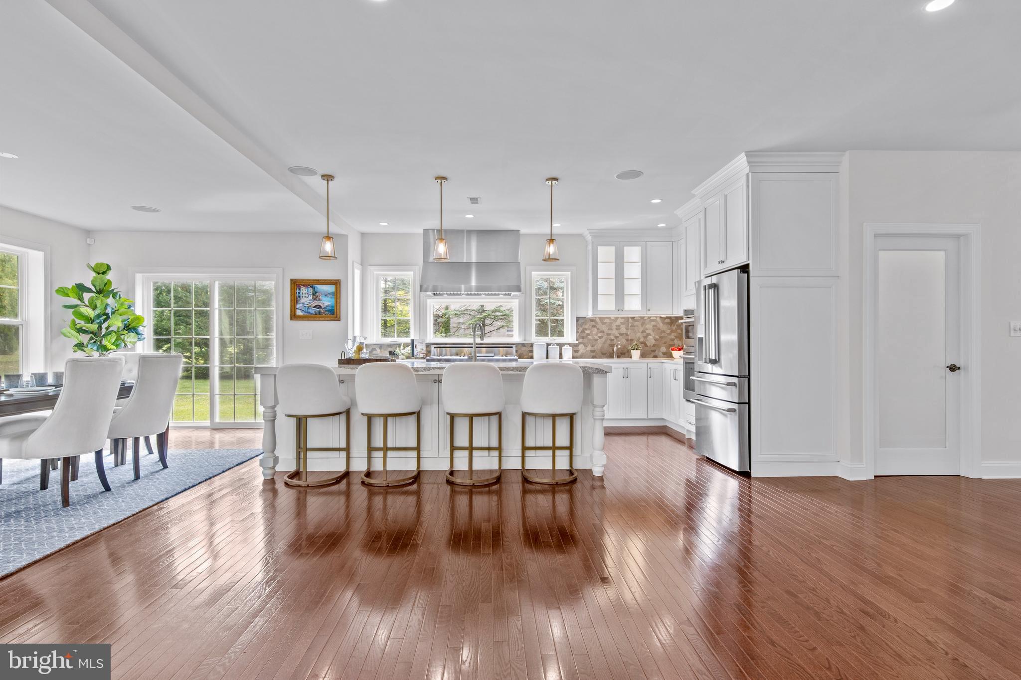444 Conestoga Road Wayne, PA 19087 - Photo 18 of 82 a view of a dining room kitchen with furniture and wooden floor