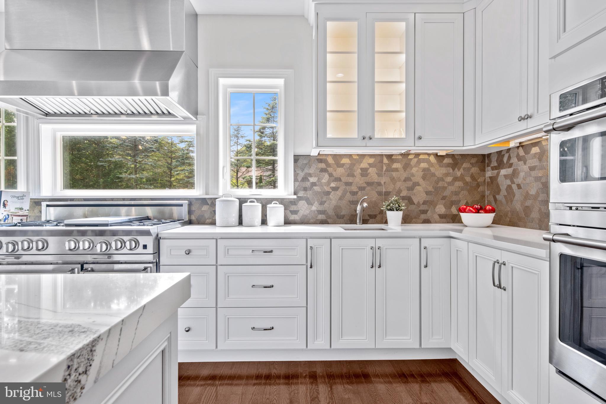 444 Conestoga Road Wayne, PA 19087 - Photo 25 of 82 a kitchen with granite countertop white cabinets and a sink