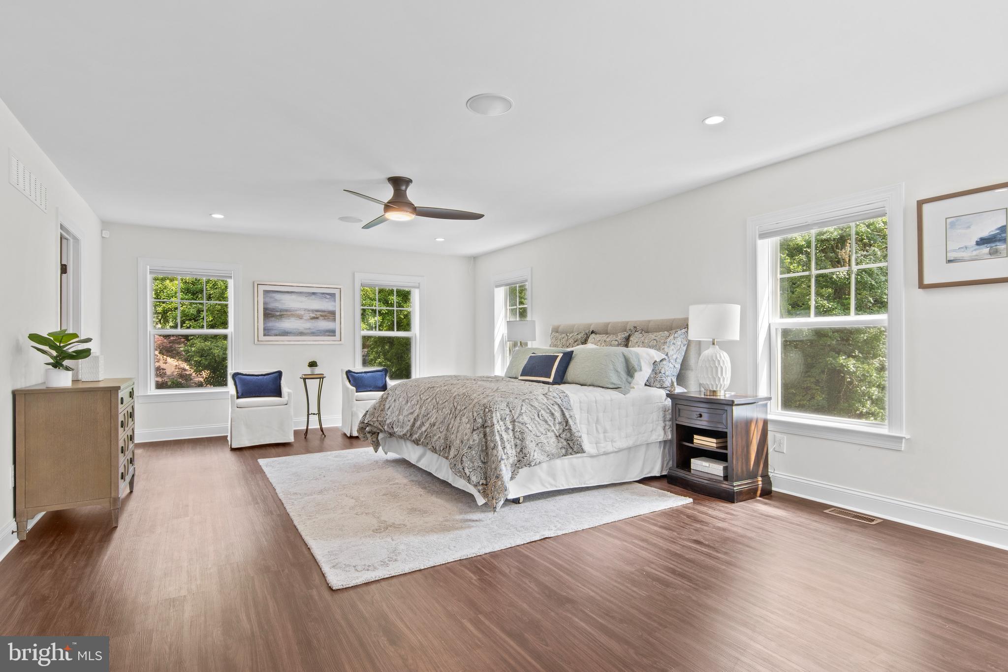 444 Conestoga Road Wayne, PA 19087 - Photo 38 of 82 a spacious bedroom with a large bed and a window