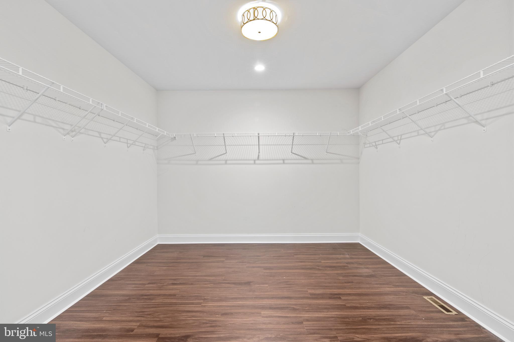 444 Conestoga Road Wayne, PA 19087 - Photo 43 of 82 a view of a room with wooden floor and white walls
