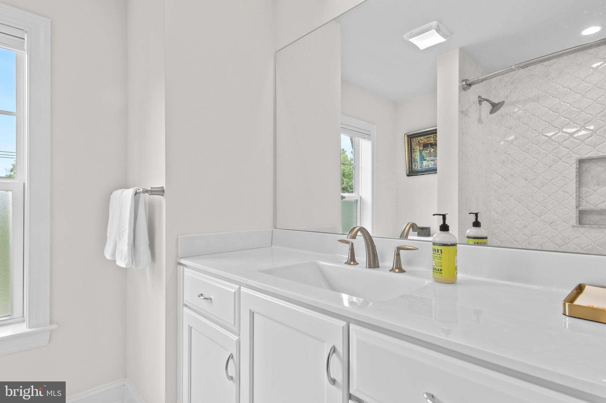 444 Conestoga Road Wayne, PA 19087 - Photo 59 of 82 a bathroom with a sink vanity and a mirror