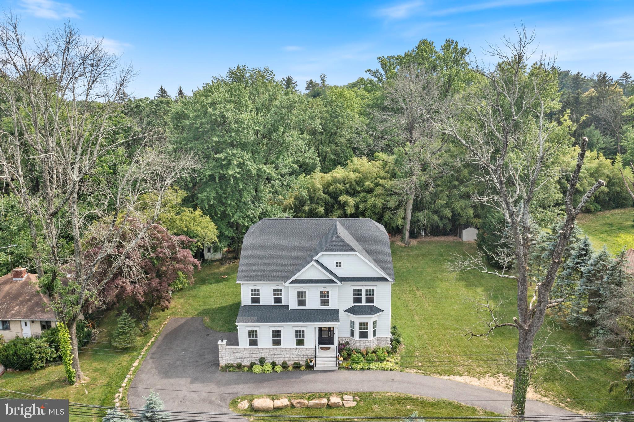 444 Conestoga Road Wayne, PA 19087 - Photo 66 of 82 a view of a big house with a big yard and large trees