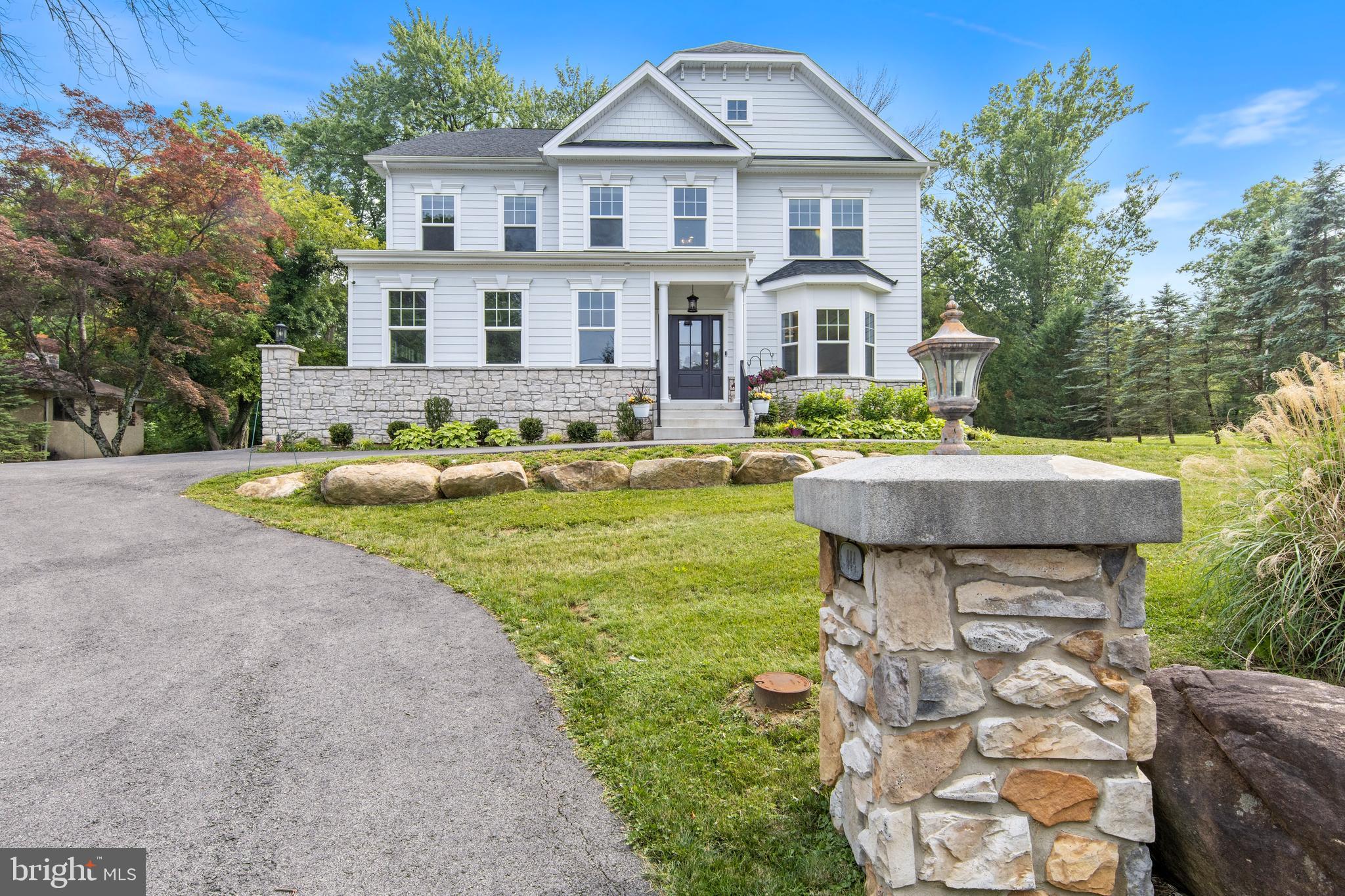 444 Conestoga Road Wayne, PA 19087 - Photo 68 of 82 a front view of a house with garden