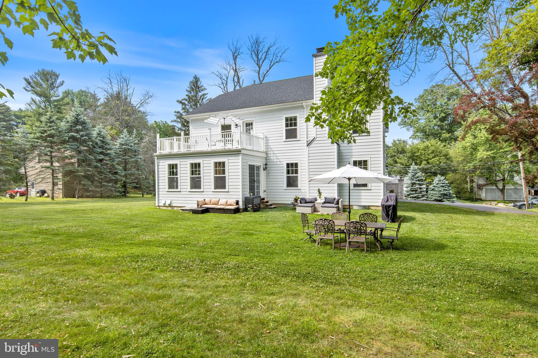 444 Conestoga Road Wayne, PA 19087 - Photo 72 of 82 a view of a house with backyard sitting area and garden
