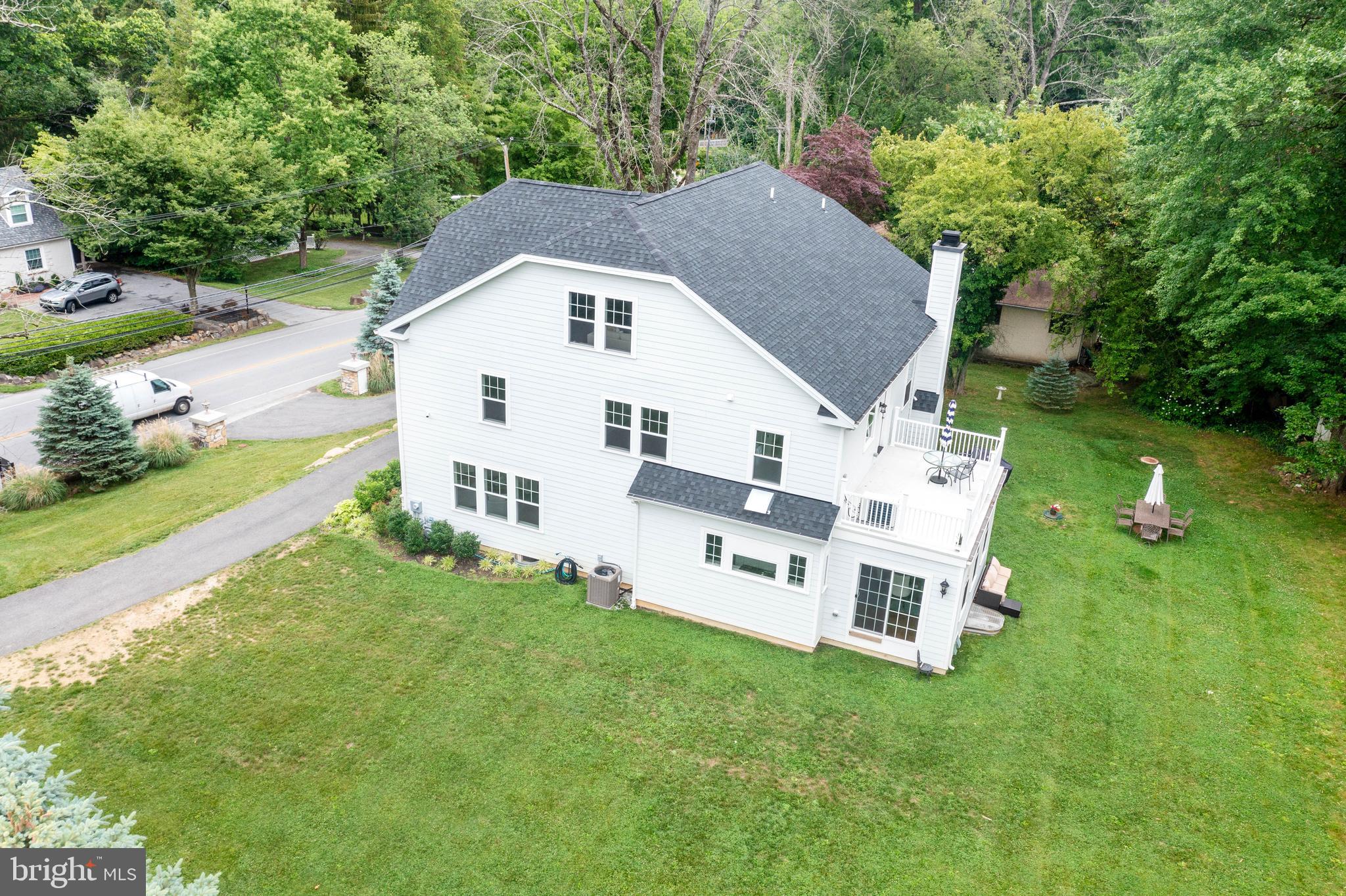 444 Conestoga Road Wayne, PA 19087 - Photo 80 of 82 a aerial view of a house with a yard table and chairs