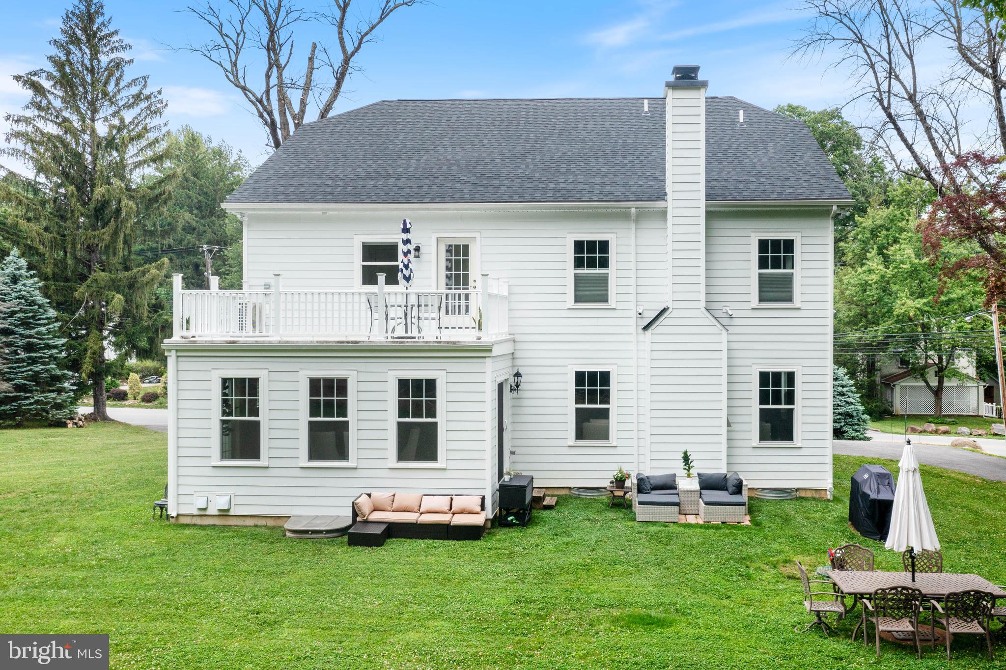 444 Conestoga Road Wayne, PA 19087 - Photo 82 of 82 a front view of a house with a garden and trees