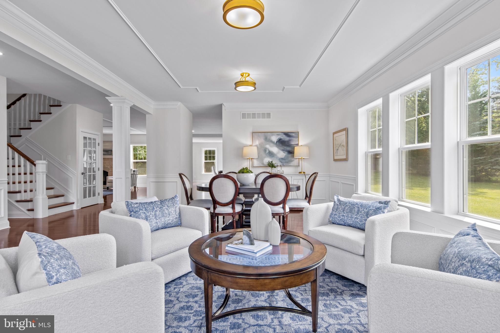 444 Conestoga Road Wayne, PA 19087 - Photo 9 of 82 a living room with furniture a fireplace and a large window