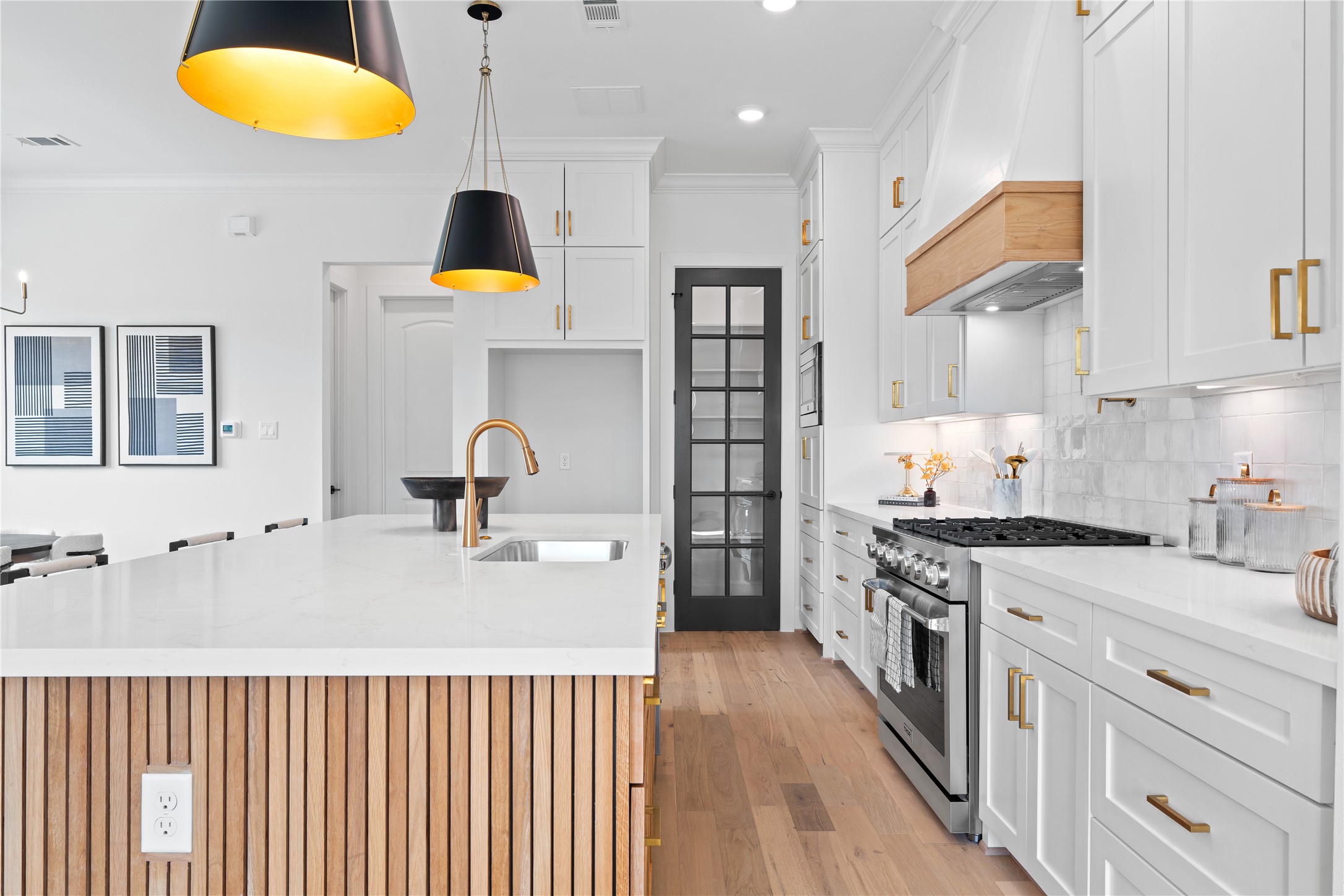 1614 Ojeman Road, Unit J Houston, TX 77055 - Photo 20 of 50 Stylish glass pantry door adds a modern and elegant touch to the space.