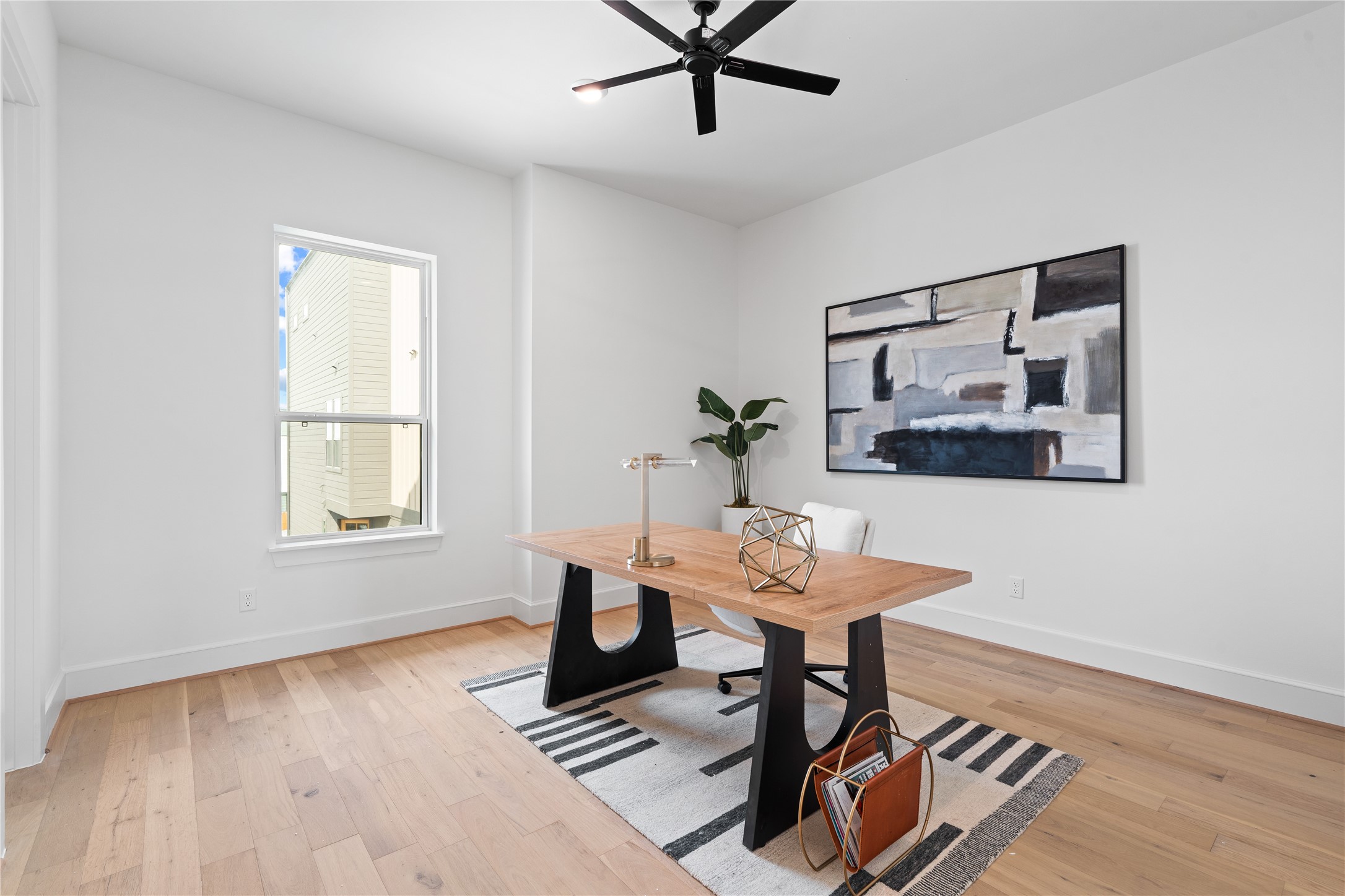 1614 Ojeman Road, Unit J Houston, TX 77055 - Photo 26 of 50 Spacious secondary bedroom on the second floor, perfect for use as a guest room, home office, or flex space to suit your lifestyle needs.