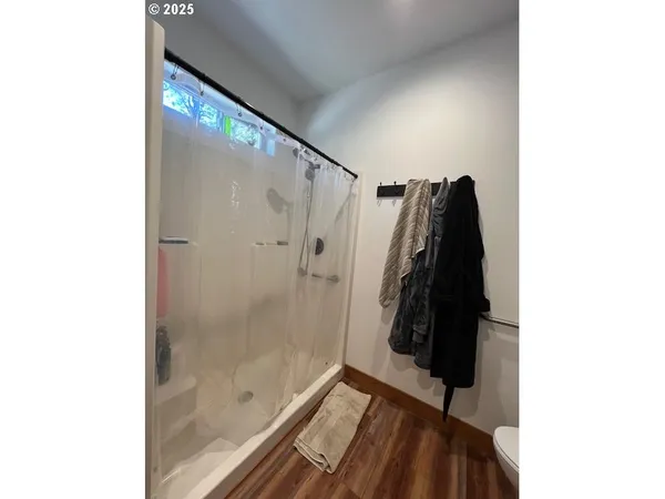 a view of walk in closet with clothes
