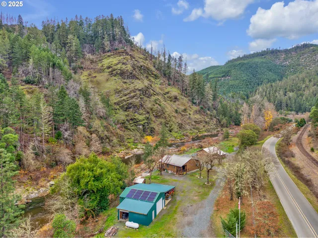 a backyard of a house with yard and outdoor seating