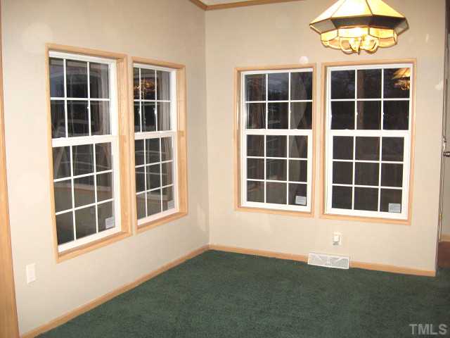 851 Royster Clay Road Roxboro, NC 27574 - Photo 4 of 12 Bright dining area with four tall windows