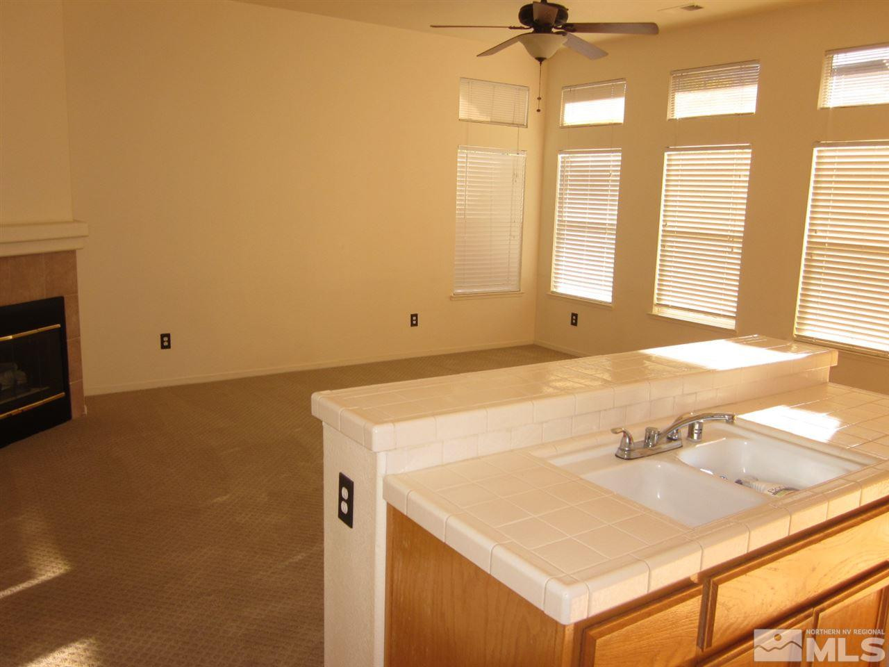 9380 Oakley Court Reno, NV 89521 - Photo 5 of 12 a view of a kitchen with a sink and a window