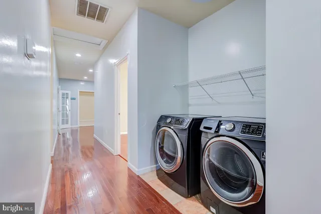 a view of wooden floor and windows in an empty room