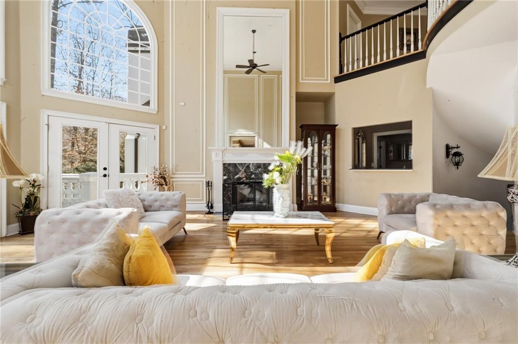4670 Hamden Forest Drive Southwest Atlanta, GA 30331 - Photo 12 of 68 a living room with fireplace furniture and a chandelier