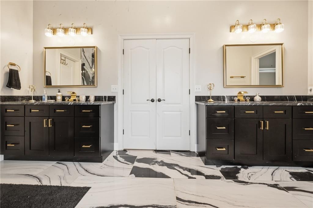 4670 Hamden Forest Drive Southwest Atlanta, GA 30331 - Photo 20 of 68 a bathroom with a sink vanity and mirror