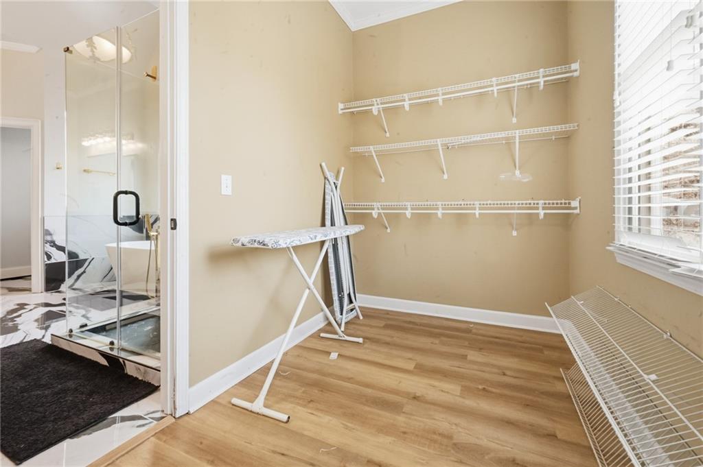 4670 Hamden Forest Drive Southwest Atlanta, GA 30331 - Photo 23 of 68 a view of a room with wooden floor and bathroom