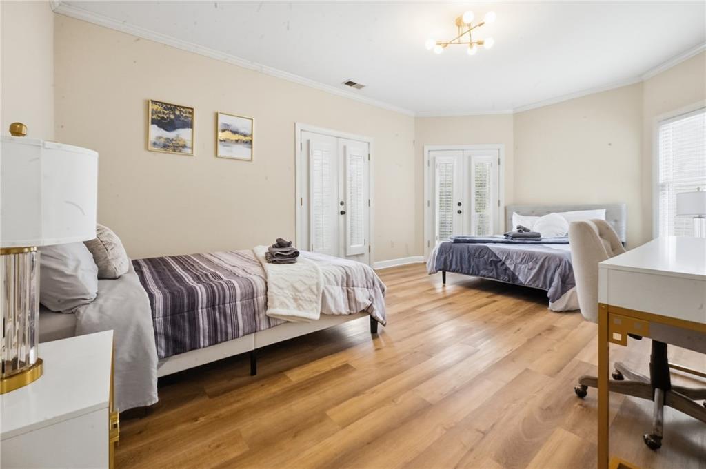 4670 Hamden Forest Drive Southwest Atlanta, GA 30331 - Photo 25 of 68 a spacious bedroom with a bed and a window