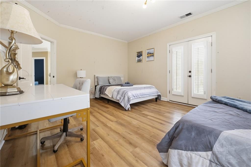 4670 Hamden Forest Drive Southwest Atlanta, GA 30331 - Photo 26 of 68 a bedroom with a bed and a table in it