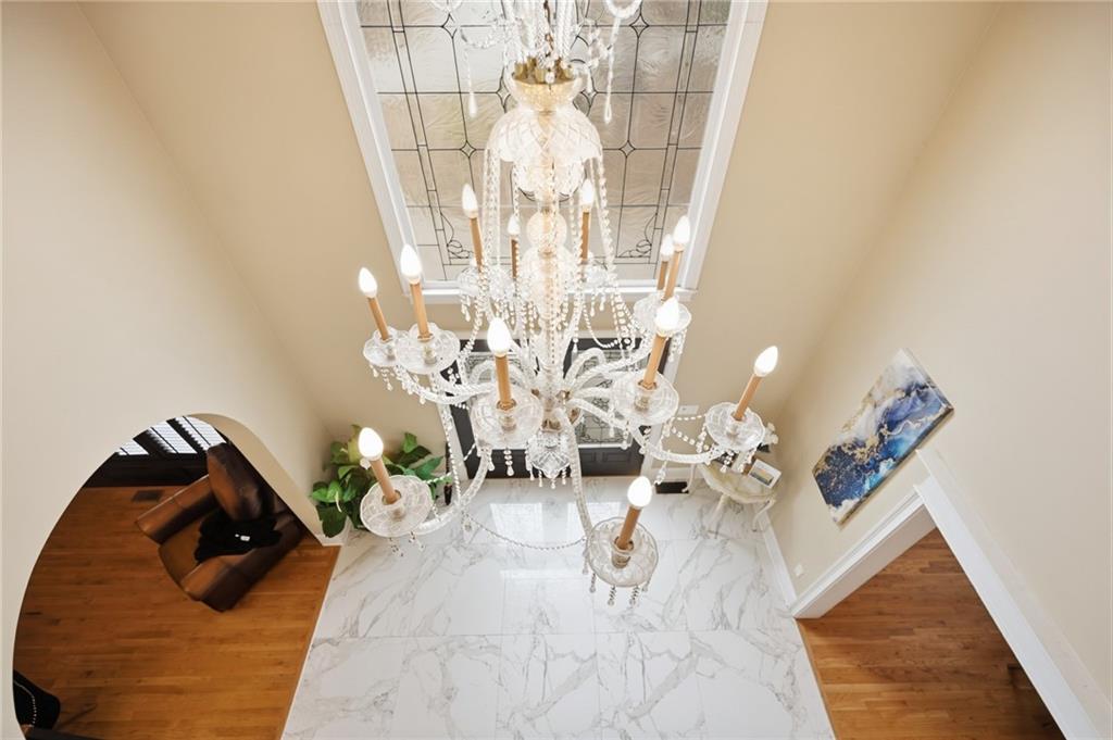 4670 Hamden Forest Drive Southwest Atlanta, GA 30331 - Photo 30 of 68 a view of living room with furniture and a chandelier