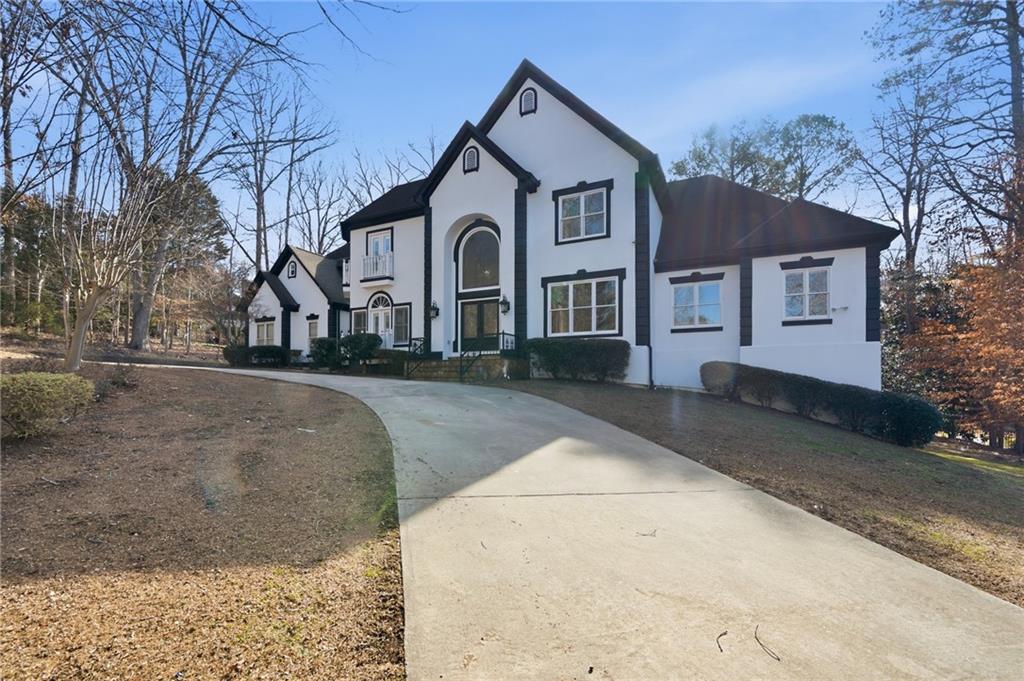 4670 Hamden Forest Drive Southwest Atlanta, GA 30331 - Photo 3 of 68 a front view of a house with a yard