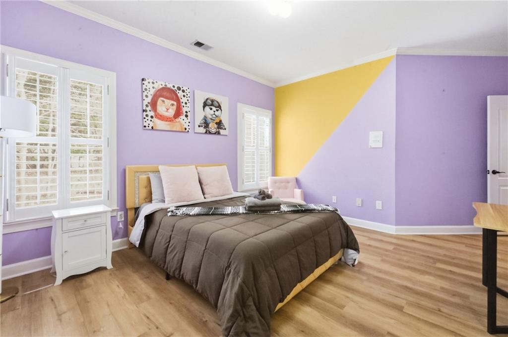 4670 Hamden Forest Drive Southwest Atlanta, GA 30331 - Photo 36 of 68 a bedroom with a bed and a window