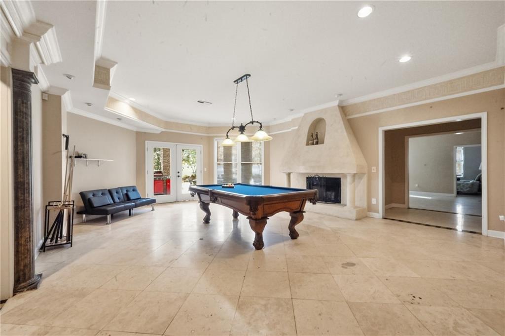4670 Hamden Forest Drive Southwest Atlanta, GA 30331 - Photo 37 of 68 a living room with furniture a fireplace and chandelier
