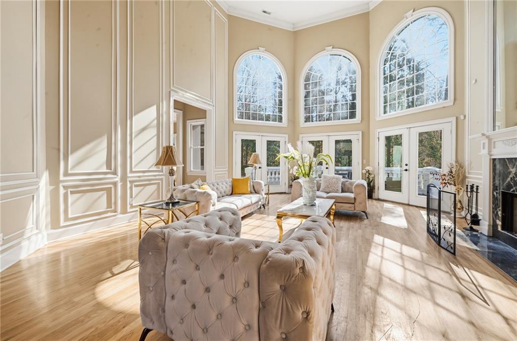4670 Hamden Forest Drive Southwest Atlanta, GA 30331 - Photo 4 of 68 a living room with furniture large windows and wooden floor