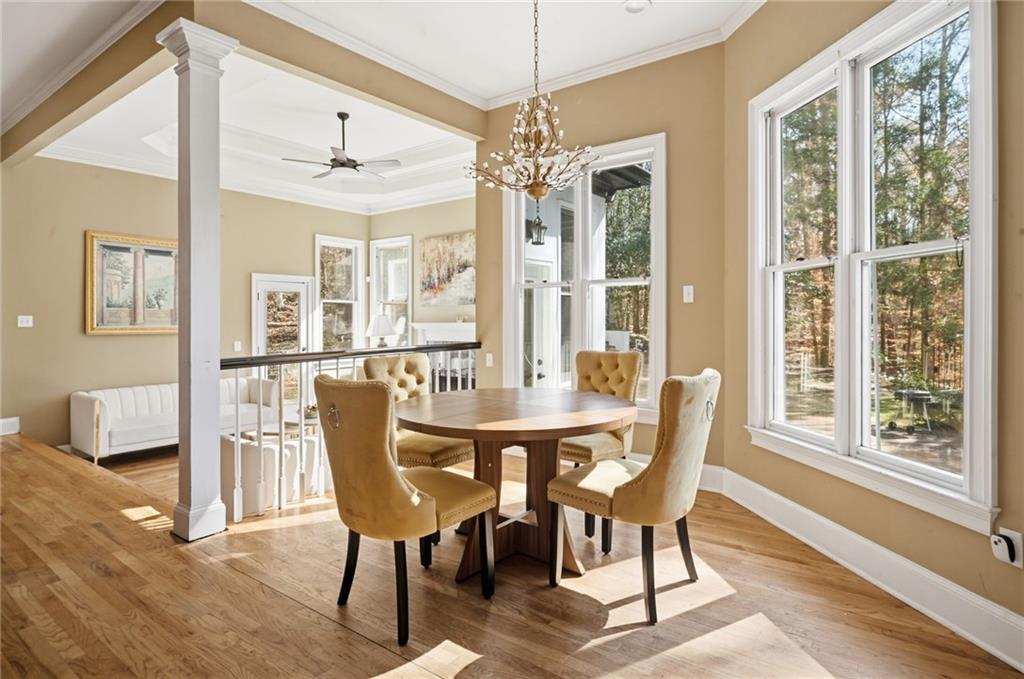 4670 Hamden Forest Drive Southwest Atlanta, GA 30331 - Photo 52 of 68 a view of a dining room with furniture window and wooden floor