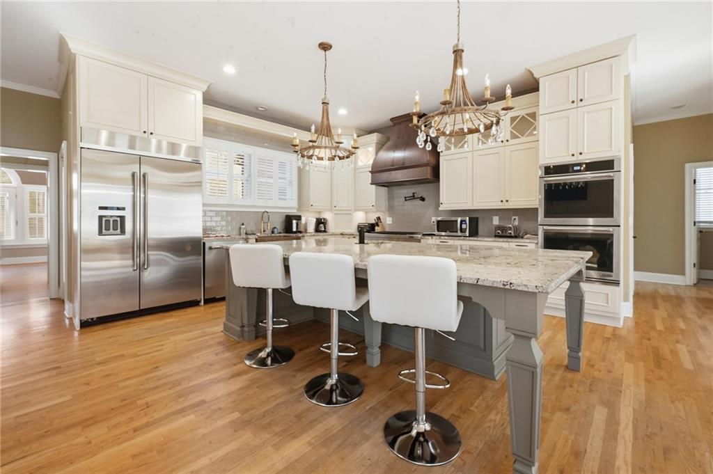 4670 Hamden Forest Drive Southwest Atlanta, GA 30331 - Photo 54 of 68 a large kitchen with a table and chairs