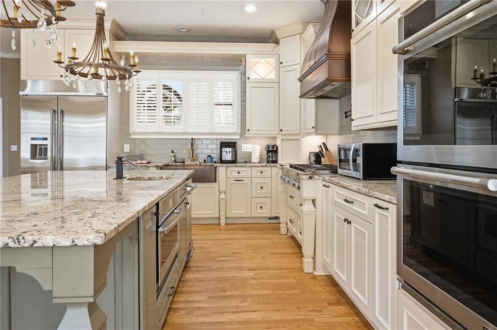 4670 Hamden Forest Drive Southwest Atlanta, GA 30331 - Photo 55 of 68 a kitchen with stainless steel appliances granite countertop a sink and cabinets