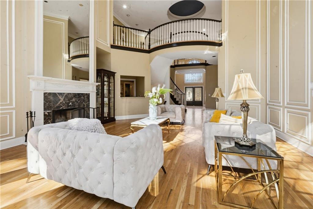 4670 Hamden Forest Drive Southwest Atlanta, GA 30331 - Photo 58 of 68 a living room with furniture fireplace and a fireplace