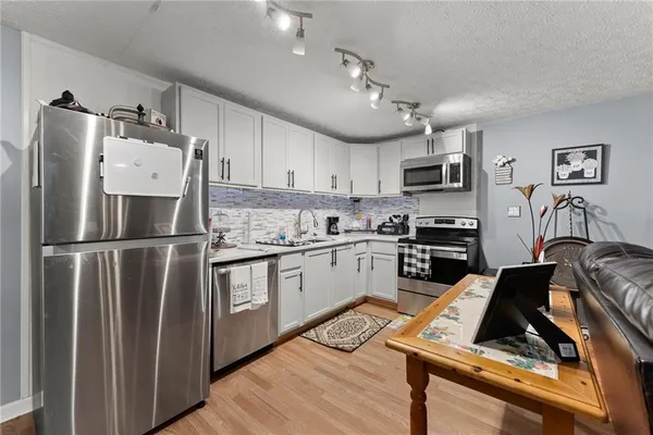 a kitchen with a stove and a sink