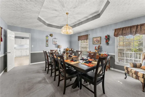 a kitchen with kitchen island granite countertop appliances cabinets and a sink