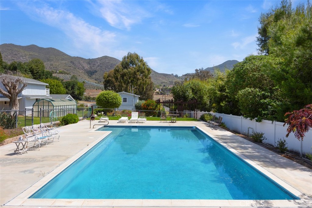 35768 Rice Canyon Road Fallbrook, CA 92028 - Photo 34 of 39 a view of a swimming pool with a mountain view