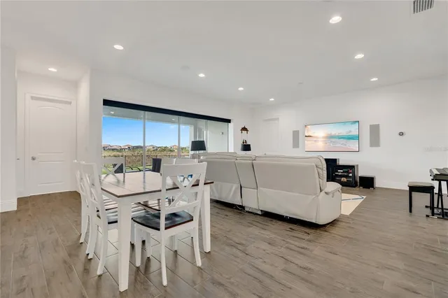 a kitchen with granite countertop white cabinets and sink