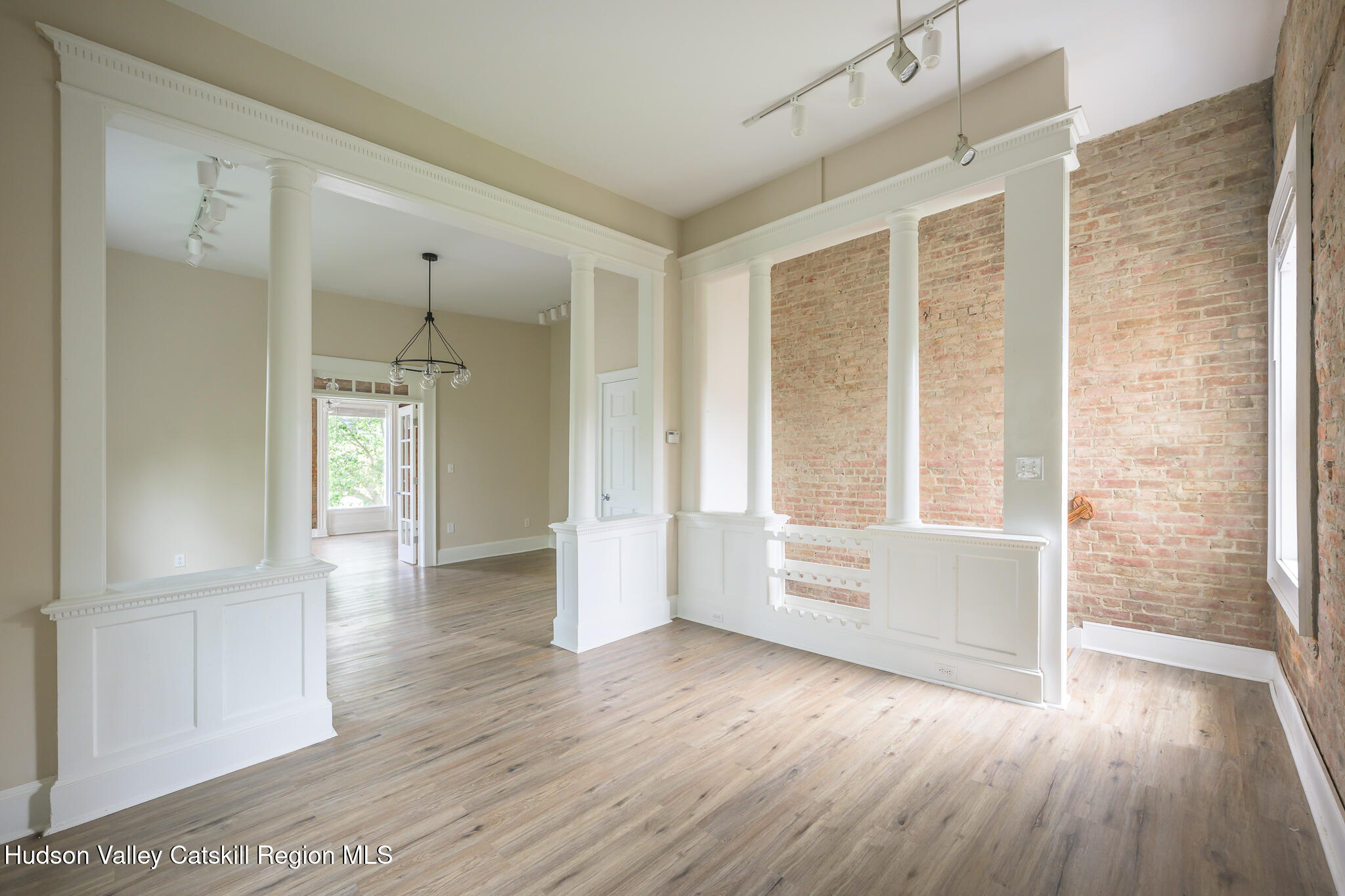 237 Warren Street Hudson, NY 12534 - Photo 14 of 39 wooden floor in an empty room with a window
