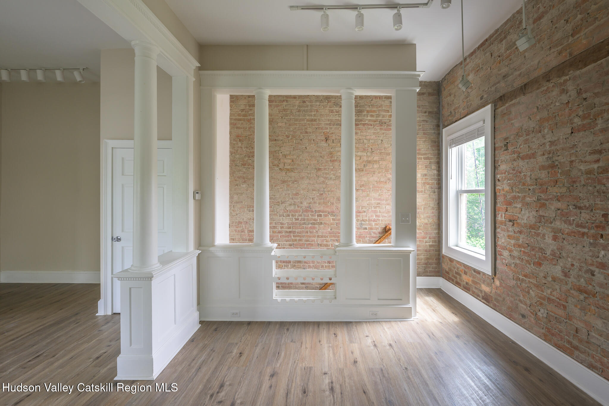 237 Warren Street Hudson, NY 12534 - Photo 15 of 39 an empty room with wooden floor and windows