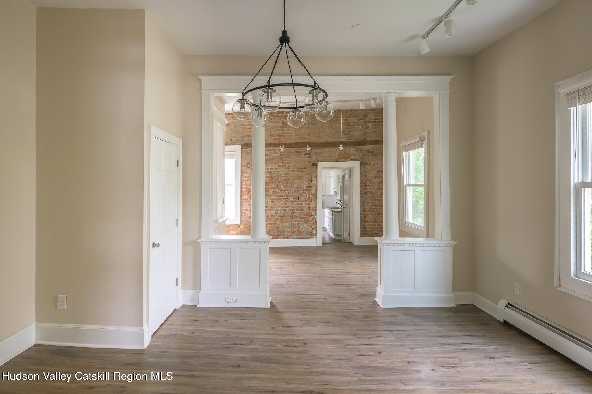 237 Warren Street Hudson, NY 12534 - Photo 17 of 39 a view of an empty room with window and chandelier fan