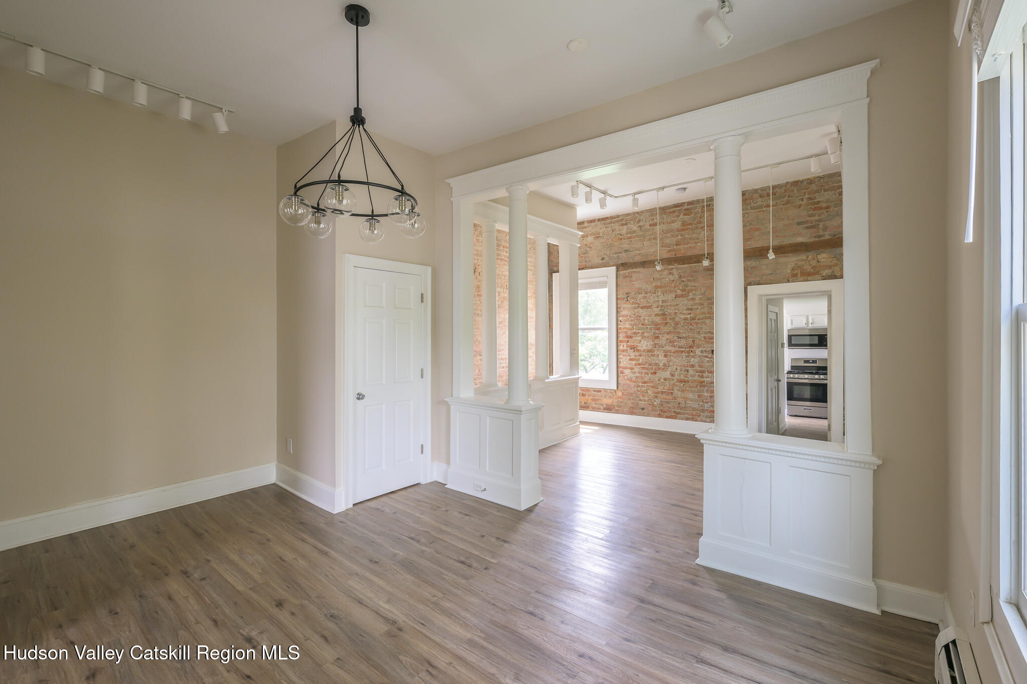 237 Warren Street Hudson, NY 12534 - Photo 18 of 39 a view of a room with wooden floor and windows