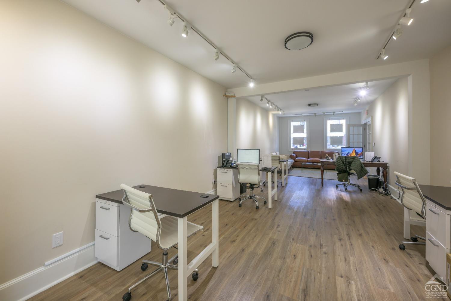 237 Warren Street Hudson, NY 12534 - Photo 6 of 39 a living room with furniture and a wooden floor