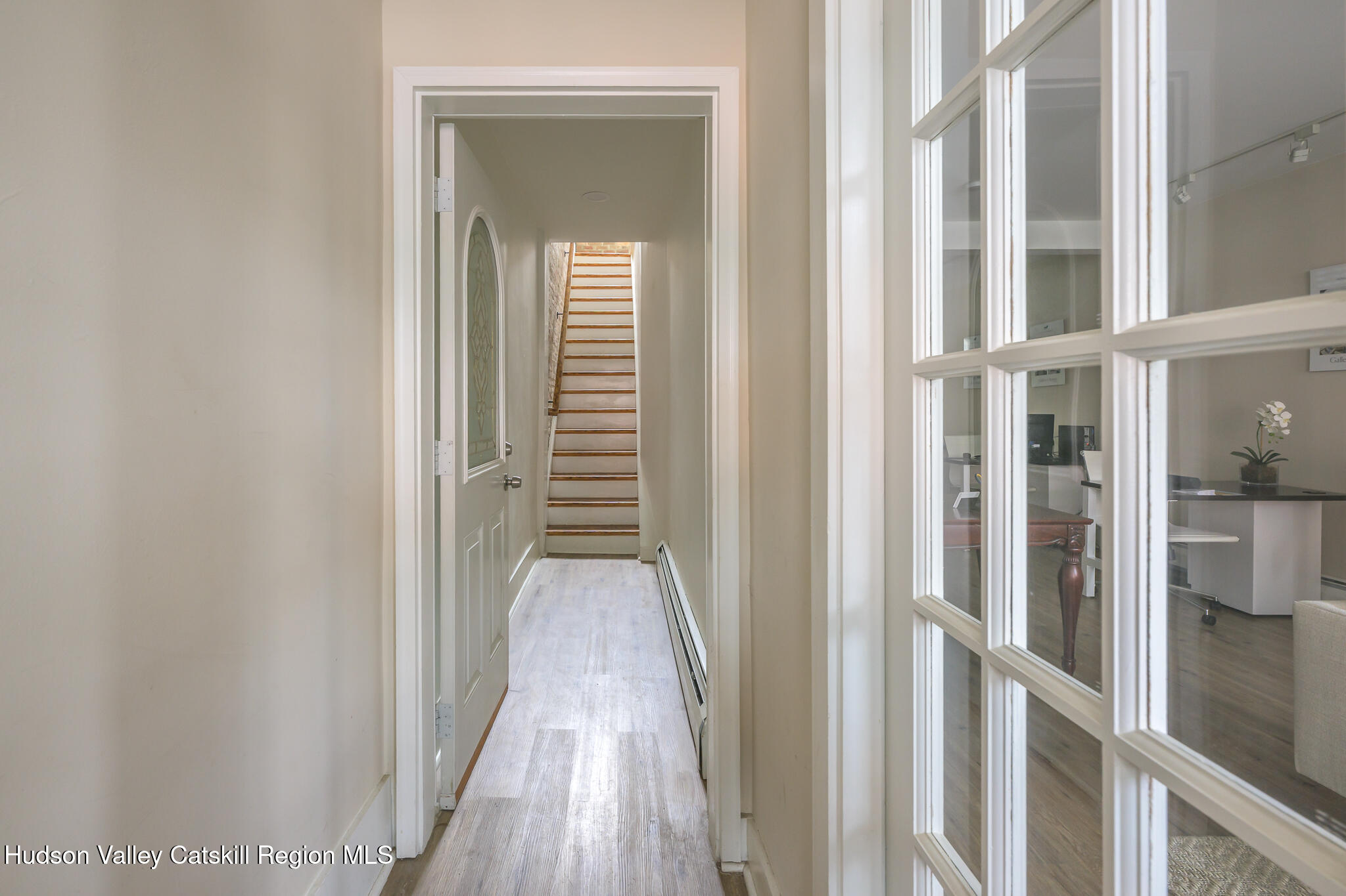 237 Warren Street Hudson, NY 12534 - Photo 10 of 39 a view of a hallway with a wooden floor