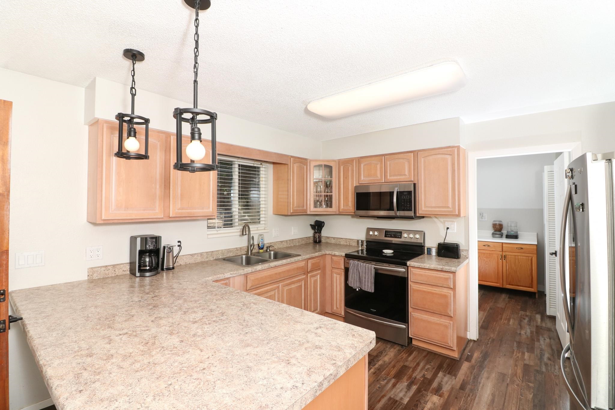 607-28 28 3/4 Road Grand Junction, CO 81506 - Photo 6 of 42 a kitchen with a sink stove and microwave