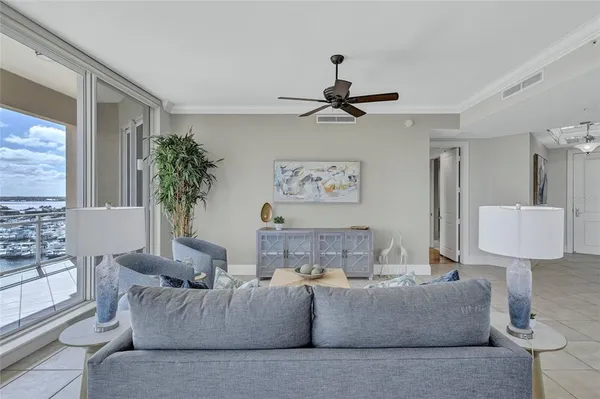 a living room with furniture and a large window