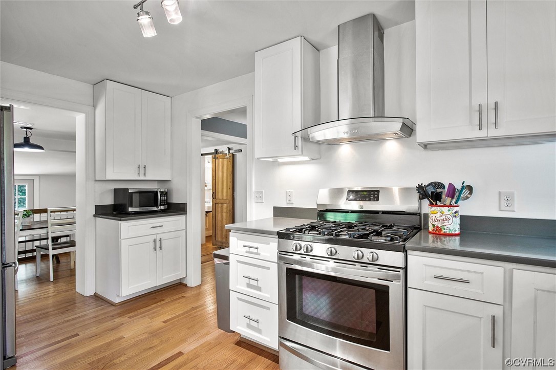 9606 Meadowview Road Henrico, VA 23294 - Photo 17 of 27 a kitchen with stainless steel appliances white cabinets and a stove top oven