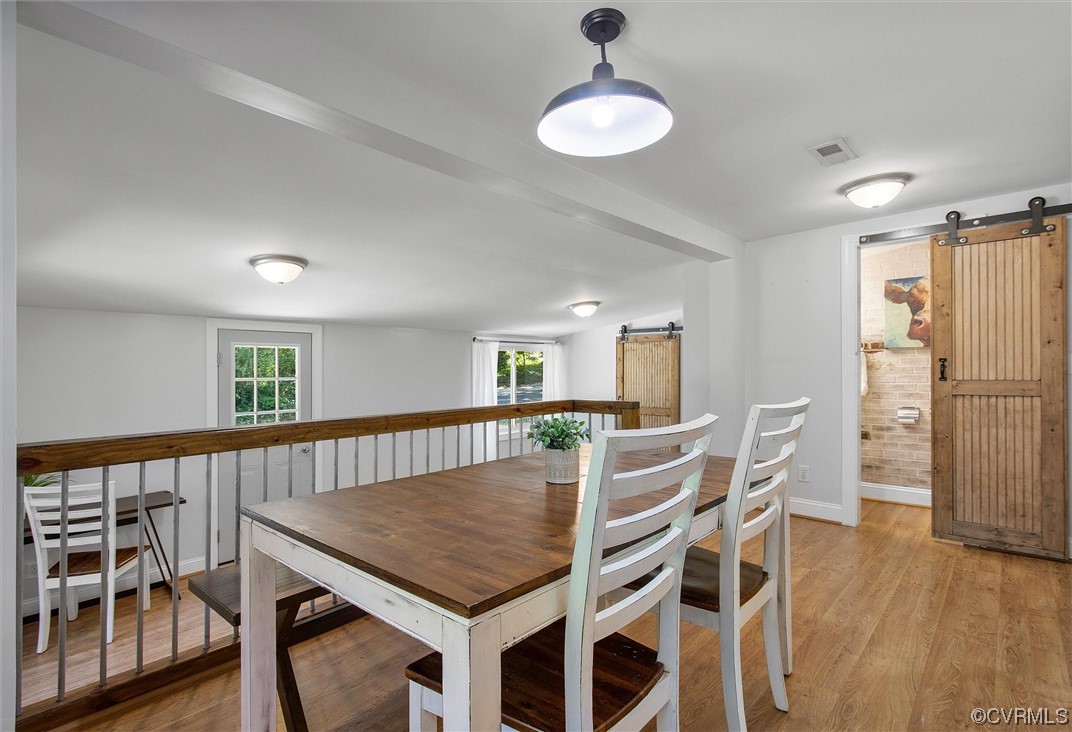 9606 Meadowview Road Henrico, VA 23294 - Photo 20 of 27 a view of a dining room with furniture and wooden floor