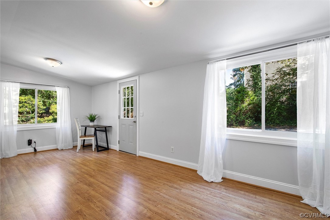 9606 Meadowview Road Henrico, VA 23294 - Photo 8 of 27 an empty room with wooden floor and windows