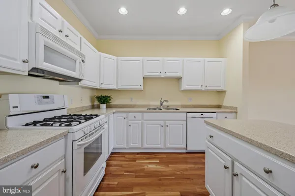 a open kitchen with a sink and dish washer