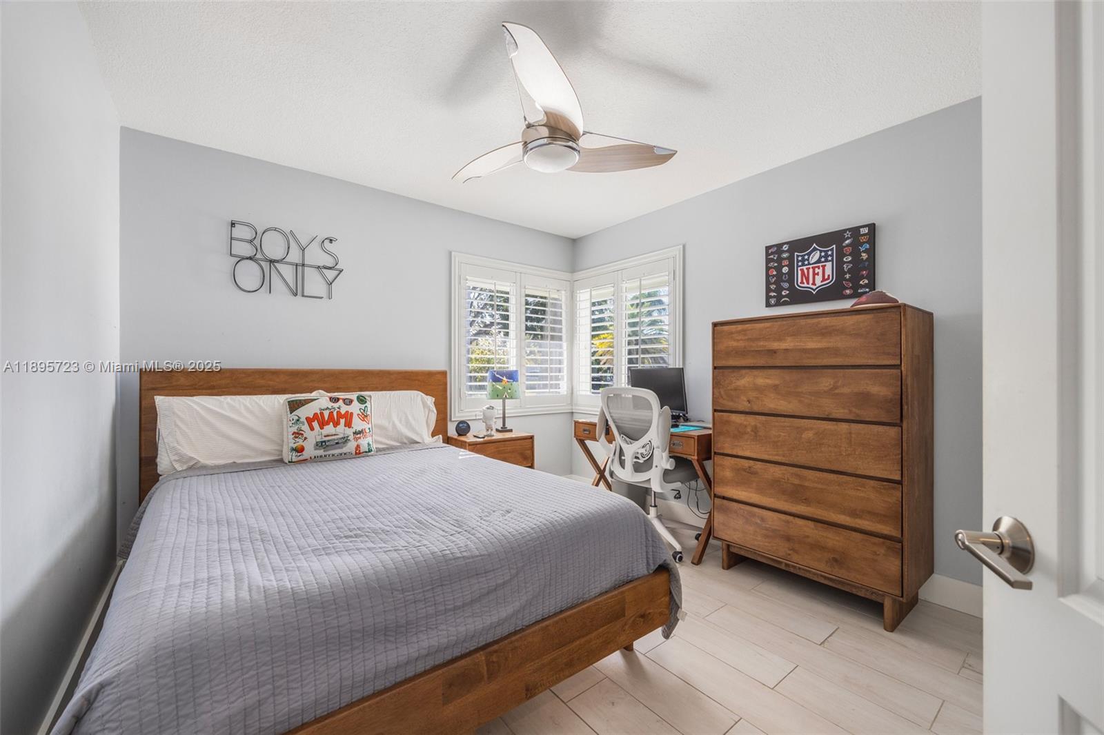 21960 Southwest 98th Avenue Cutler Bay, FL 33190 - Photo 14 of 25 a bedroom with a bed and a window